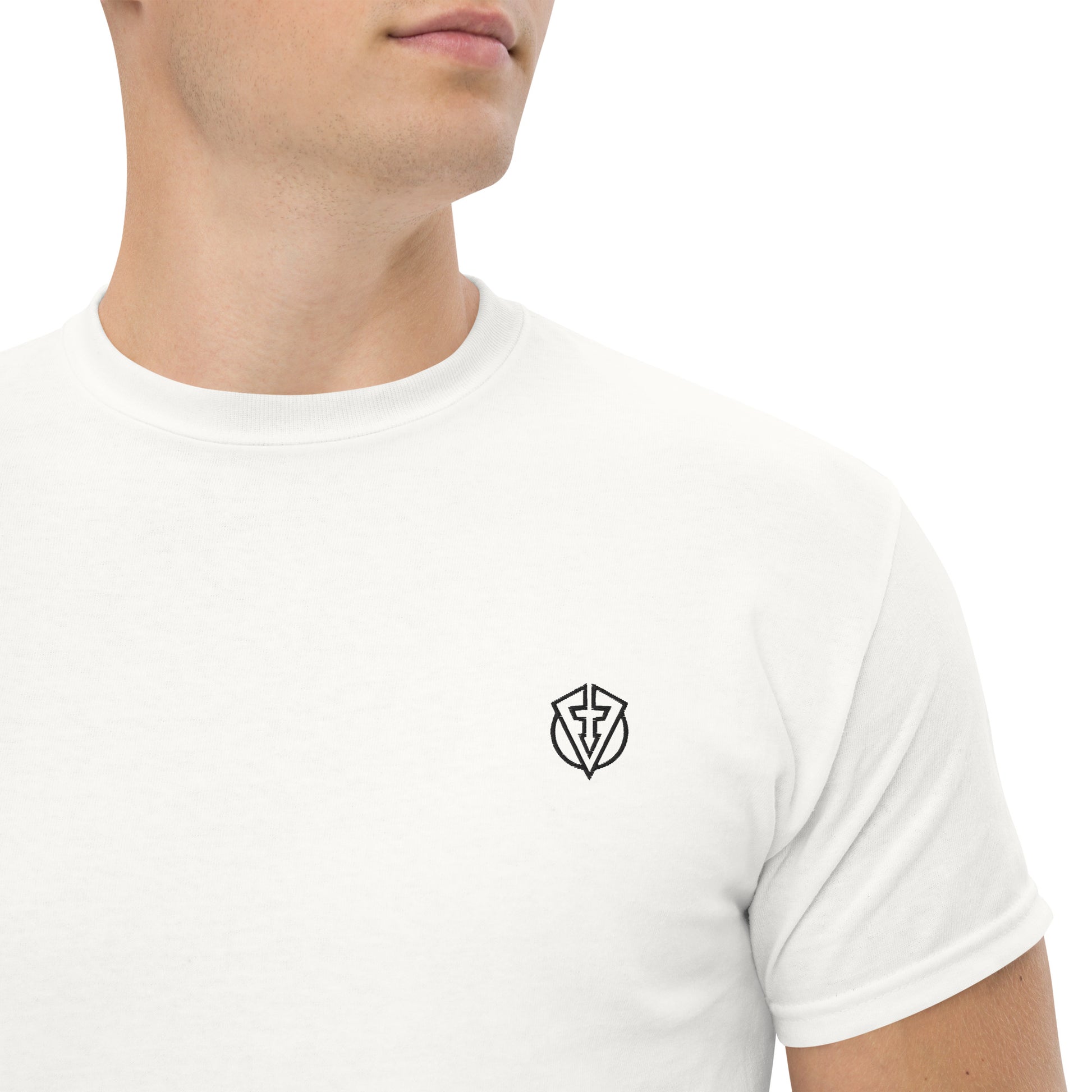 Close up of a White cotton casual golf t-shirt with a small embroidered design on a plain background by fourteefore