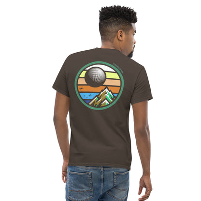 Male model wearing Brown twilight golf Fourteefore casual everyday golf streetwear cotton t-shirt with a bold colorful graphic of a mountain, moon and stars at dusk on the back against with a small FTF logo embroidered on the left chest
