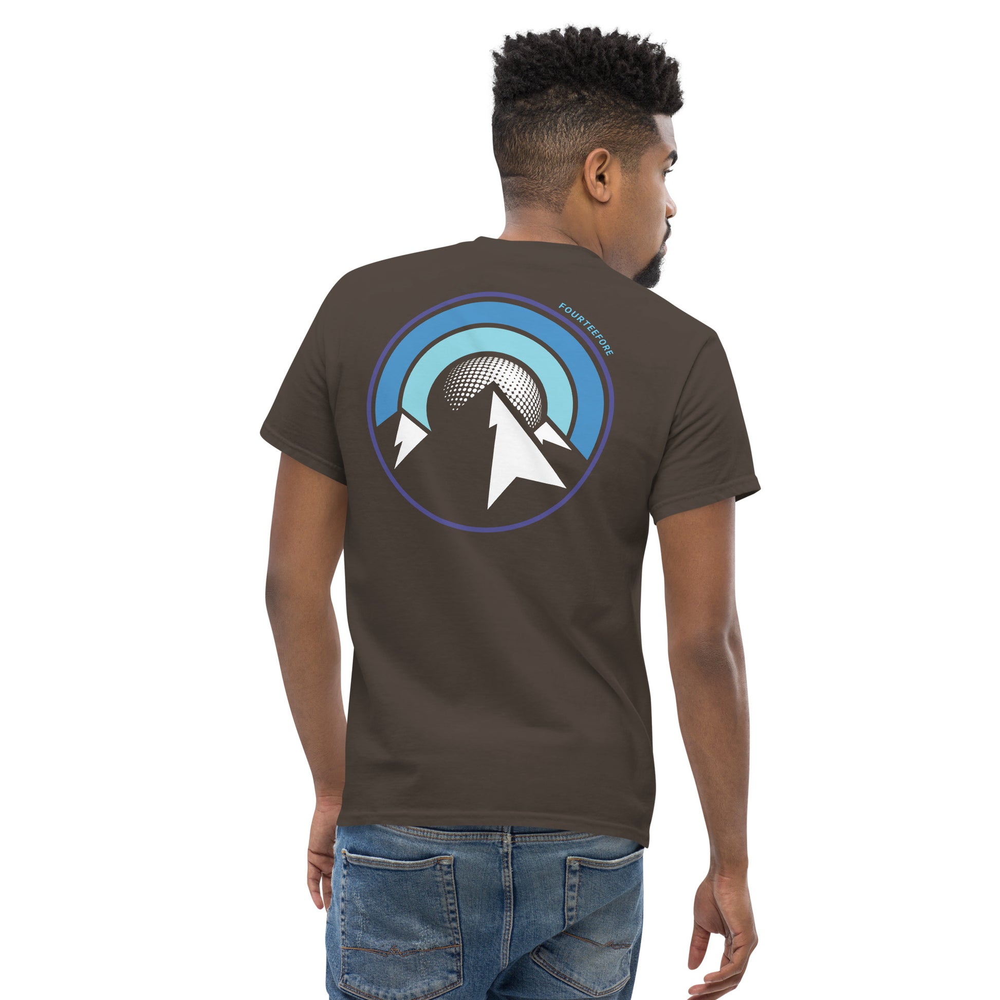 Male model wearing a Brown uphill lie fourteefore casual golf t-shirt with a bold colourful mountain and moon graphic on the back and a small FTF embroidered logo on the left chest. Casual everyday golf streetwear by fourteefore