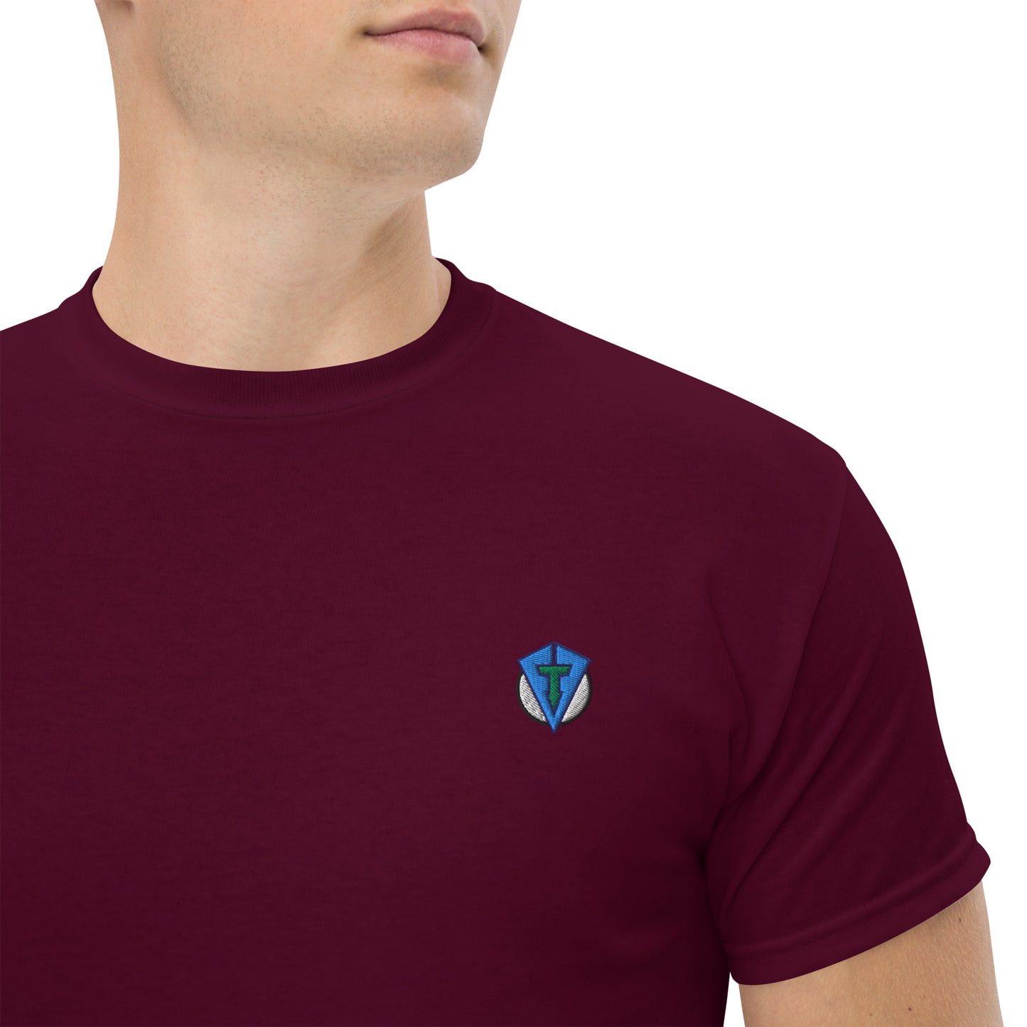 Maroon casual streetwear golf t-shirt with a small logo on the chest against a white background. Casual everyday golf streetwear by fourteefore