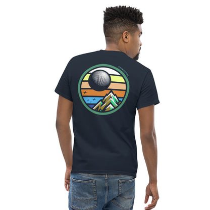 Male model wearing a Navy blue twilight golf Fourteefore casual golf streetwear t-shirt with a bold colorful graphic of a mountain, moon and stars at dusk on the back with a small FTF logo embroidered on the left chest